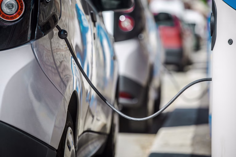 Small electric vehicle at a charging station