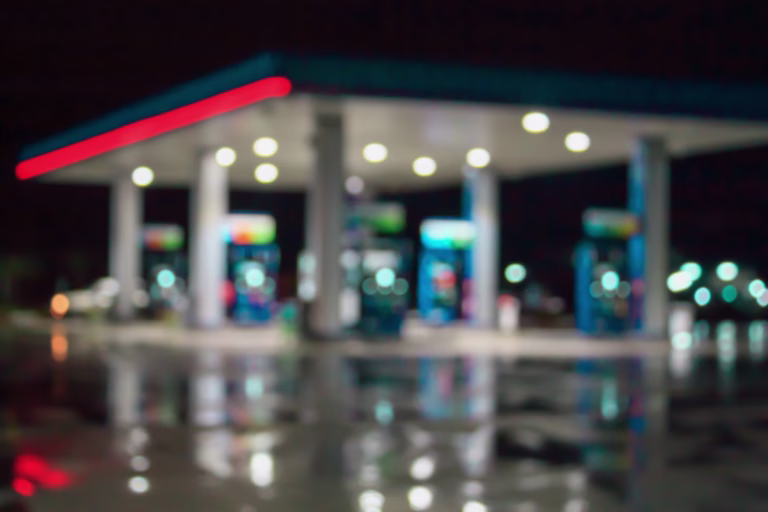 blur image of gas station at night