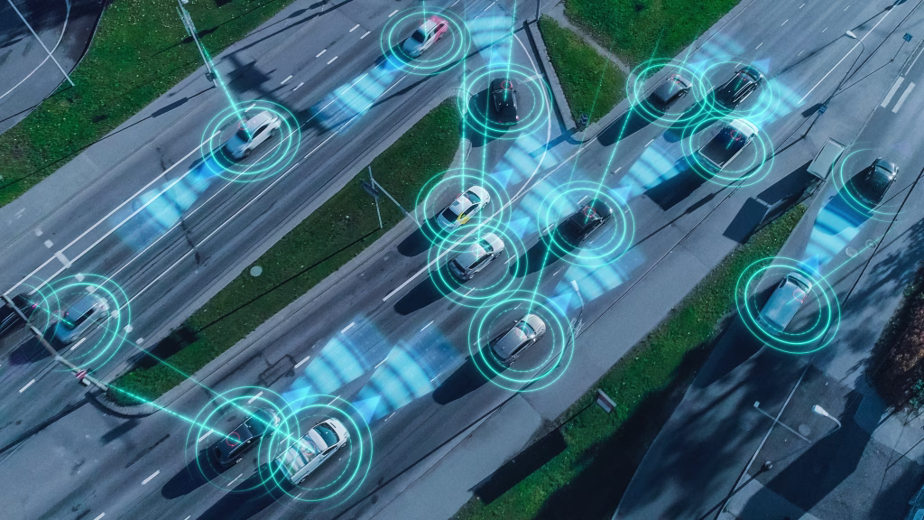 Top Down Aerial Drone: Autonomous Self Driving Cars Moving Through City. Concept: Artificial Intelligence Scans Surrounding Environment, Detecting Cars, Avoids Traffic Jams and Drives Safely.