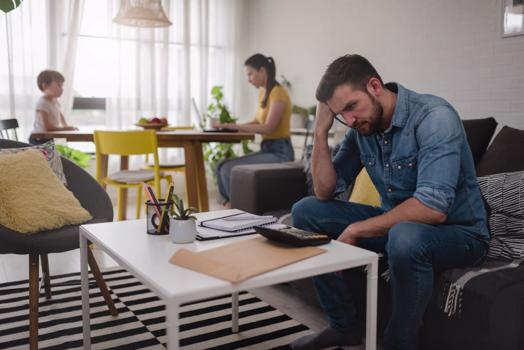 Young man at home doing home budgeting. Financial planning for family future.