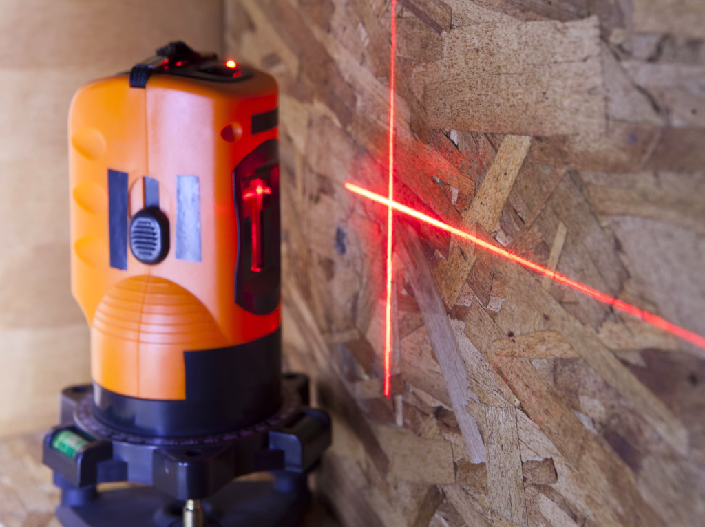 laser measurement level for construction works, small depth of sharpness, focus on a wall with a tag