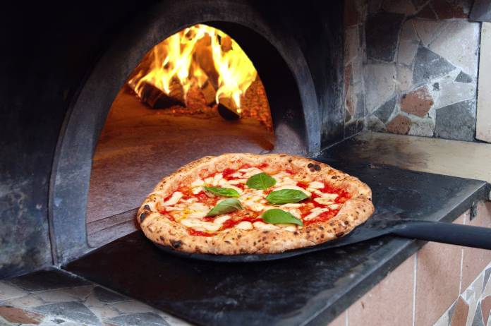 pizza-margherita-in-italy-naples-just-out-of-the-wood-oven-stockpack-istock pizza margherita in Italy Naples just out of the wood oven