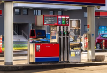 V torek olajšanje za voznike? Dizel naj bi se pocenil kar za … Ljubljana, Slovenia December 30, 2025, fuel pump at gas station, a close-up view of a modern fuel pump at a gas station with multiple nozzles for different fuel types, digital display showing price and liters, and safety signs visible, with cars and buildings in the background