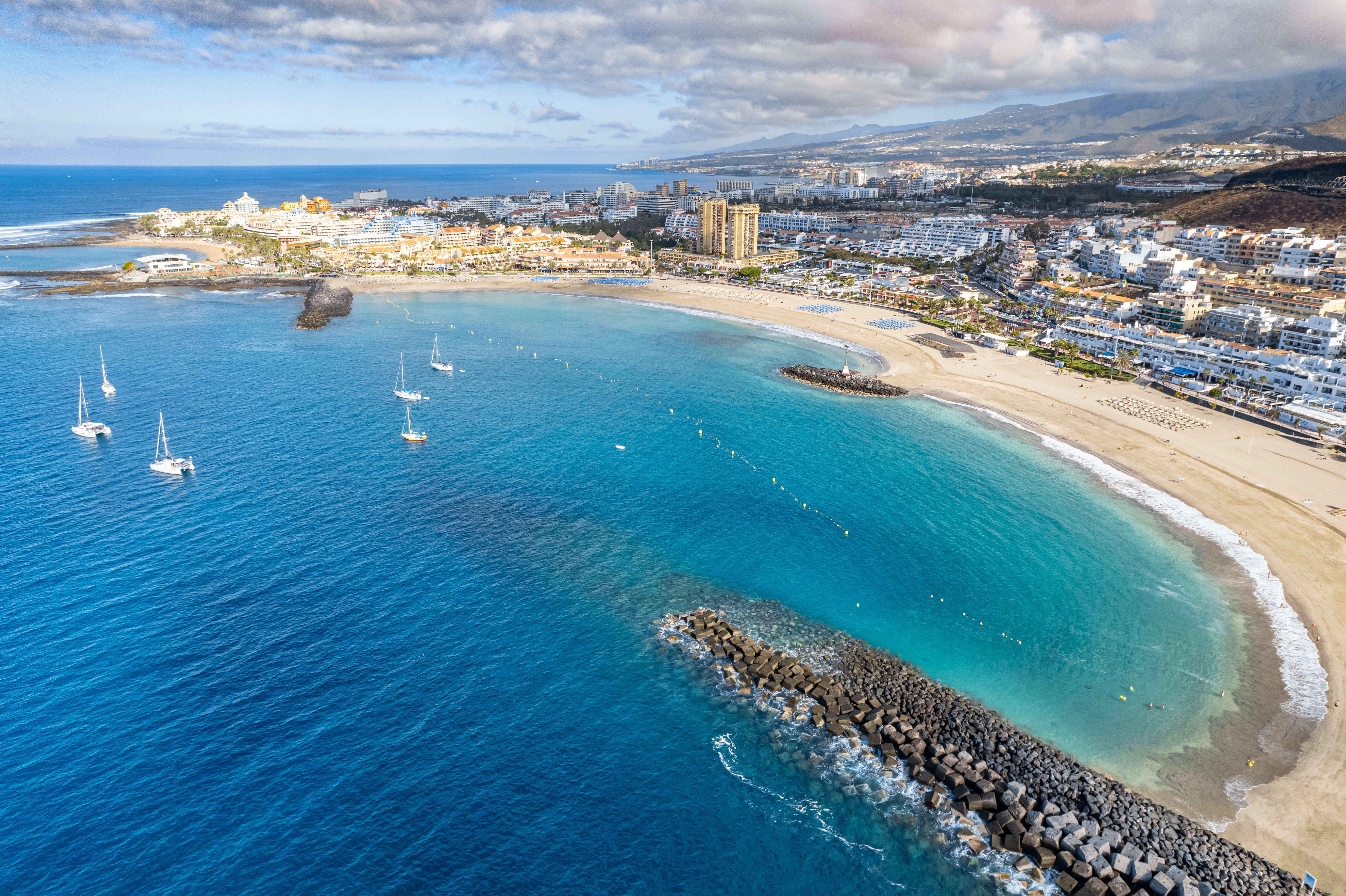 aerial-view-of-los-cristianos-and-playa-de-las-americas-on-the-island-of-tenerife-in-the-canary-islands-stockpack-istock Aerial view of Los Cristianos and Playa de las Américas on the Island of Tenerife in the Canary Islands