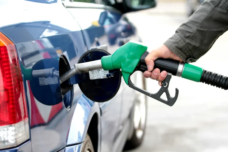 Pumping fuel in to the tank close up image