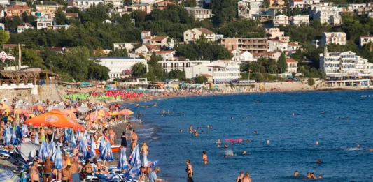 SUTOMORE, MONTENEGRO - SEPTEMBER 07, 2015:  Unidentified people are relaxing on the beach. Montenegro is one of the most attractive destinations for tourists