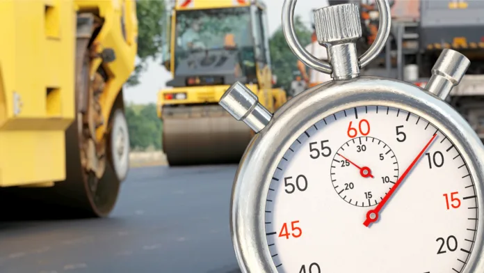 symbolic-image-stopwatch-in-front-of-road-construction-site-stockpack-istock Symbolic image: Stopwatch in front of road construction site