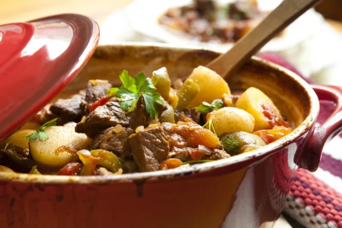 traditional-goulash-or-beef-stew-in-red-crock-pot-ready-to-serve-shallow-dof-more-beef-images-stockpack-istock Traditional goulash or beef stew, in red crock pot, ready to serve. Shallow DOF. More beef images: