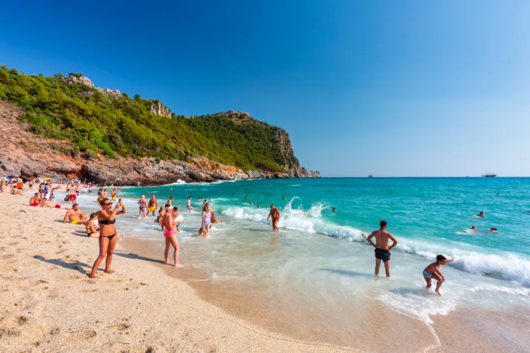 Alanya, Turkey - July 21, 2021: Tourists on the Cleopatra Beach of Alanya at the Mediterranean Sea, Turkey.