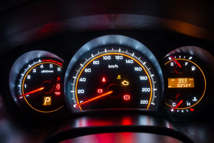 Modern car instrument dashboard panel in night time