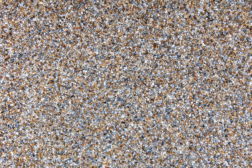 Stone carpet floor background, marble pebbles and epoxy resin, topview