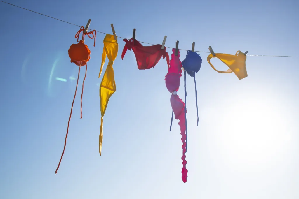 Time and desire for the summer season, colorful women's costumes lying in the sun to dry.