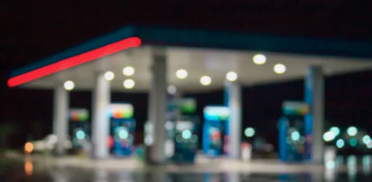 blur image of gas station at night