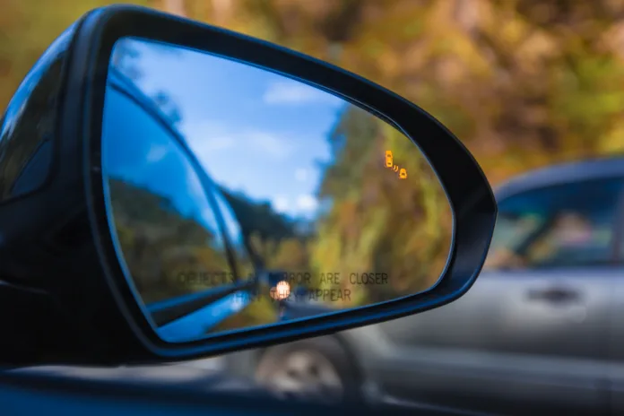 objects-in-mirror-are-closer-than-they-appear-on-car-with-blind-spot-assist-warning-led-sensor-light-stockpack-istock Objects in mirror are closer than they appear on car with Blind Spot Assist Warning LED Sensor Light
