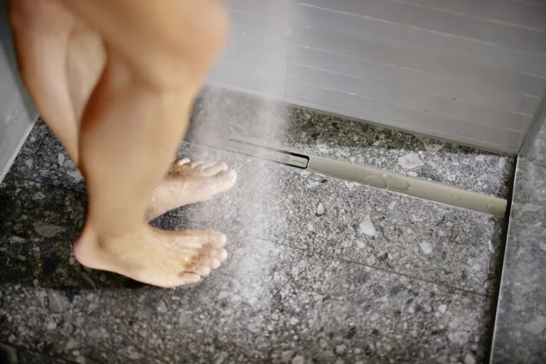 2026_Bathroom_CleanLine30_with_model_closeup_feet_wet