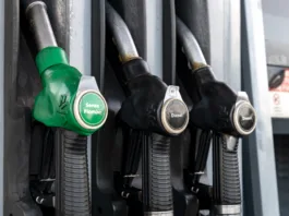 Piove di Sacco, Padua, Veneto, Italy - Aug 10th, 2025: Fuel dispenser at a gas station showing diesel and unleaded petrol pump nozzles
