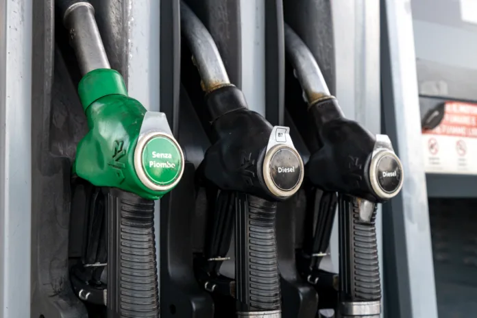 Piove di Sacco, Padua, Veneto, Italy - Aug 10th, 2025: Fuel dispenser at a gas station showing diesel and unleaded petrol pump nozzles