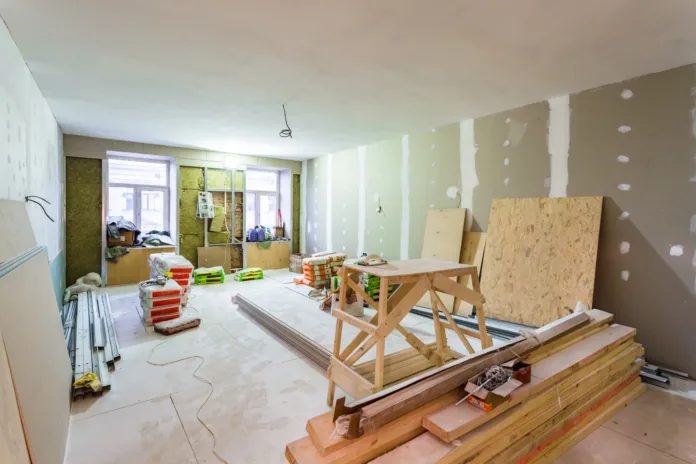 working-process-of-installing-metal-frames-for-plasterboard-drywall-for-making-gypsum-walls-in-apartment-is-under-construction-remodeling-renovation-extension-restoration-upgrading-and-reconstruction-stockpack-istock Working process of installing metal frames for plasterboard -drywall- for making gypsum walls in apartment is under construction, remodeling, renovation, extension, restoration, upgrading and reconstruction.